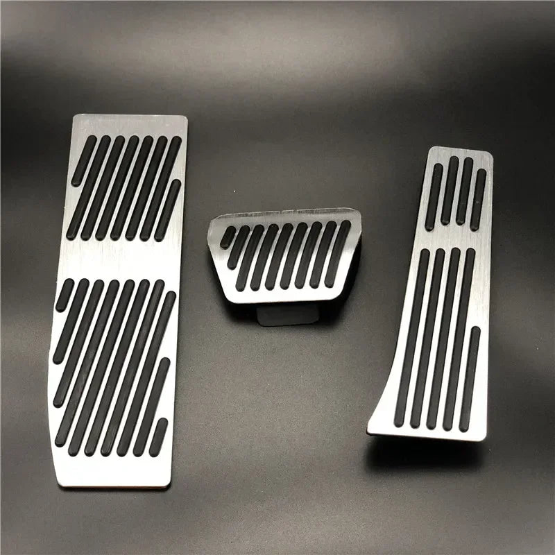 "Silver-black aluminum pedal covers for BMW E30, E36, E46, E90, and M3 models. Black base with silver accents."