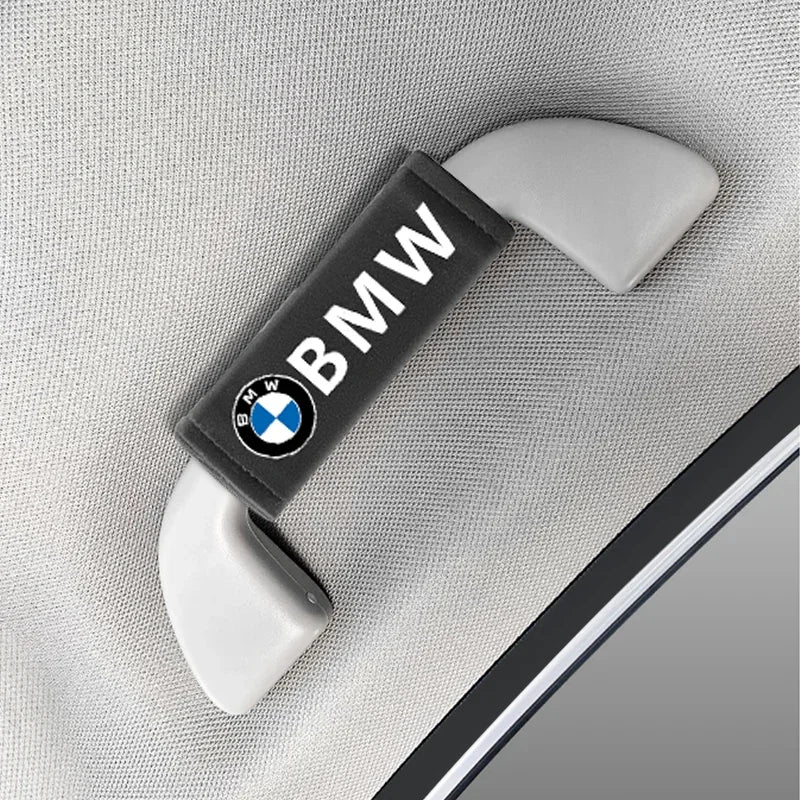 "BMW logo on black interior pull strap for M-Style Roof Handle Grip Cover."