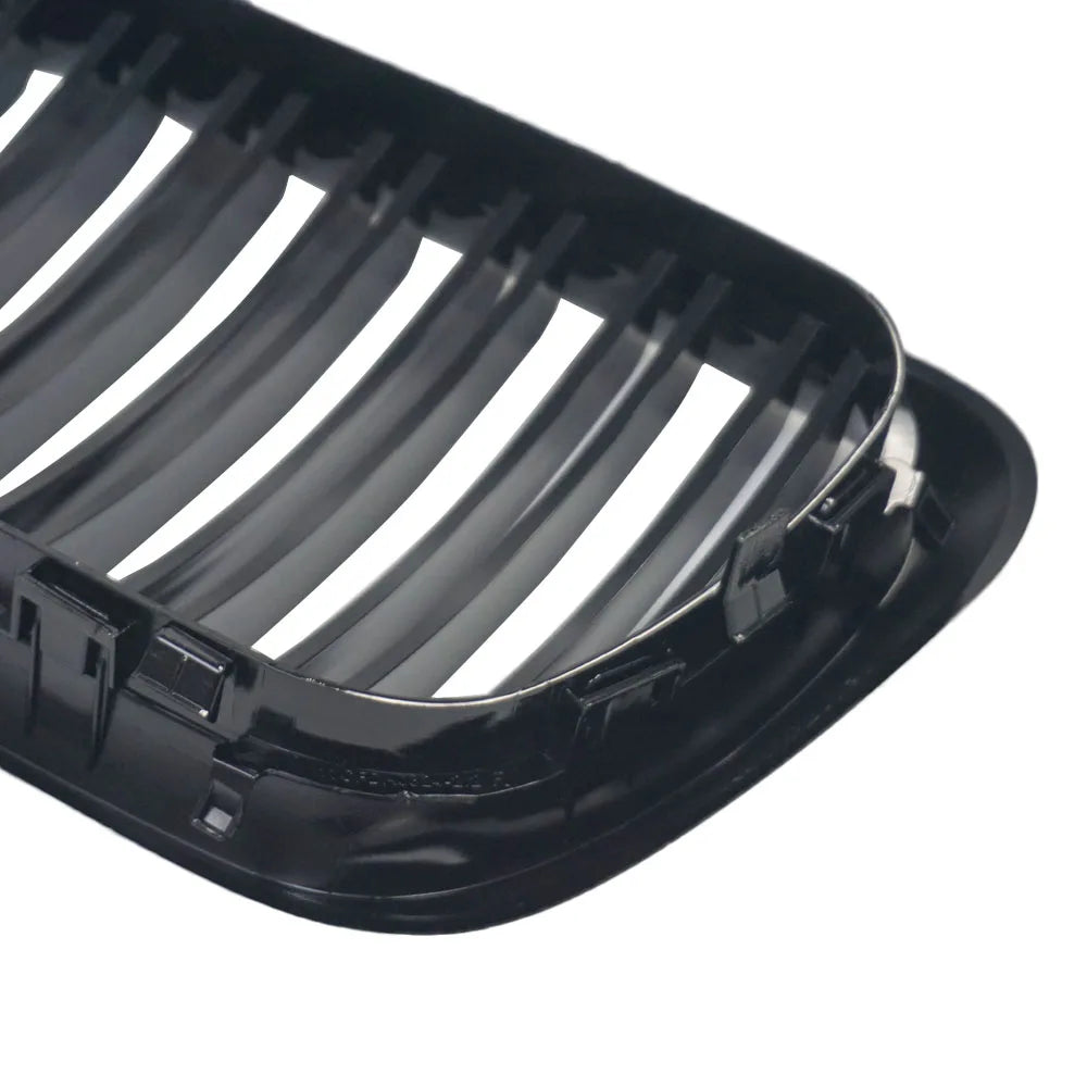 "Gloss Black Kidney Grille for BMW E36 (1997-1999), replacement black plastic grille component."