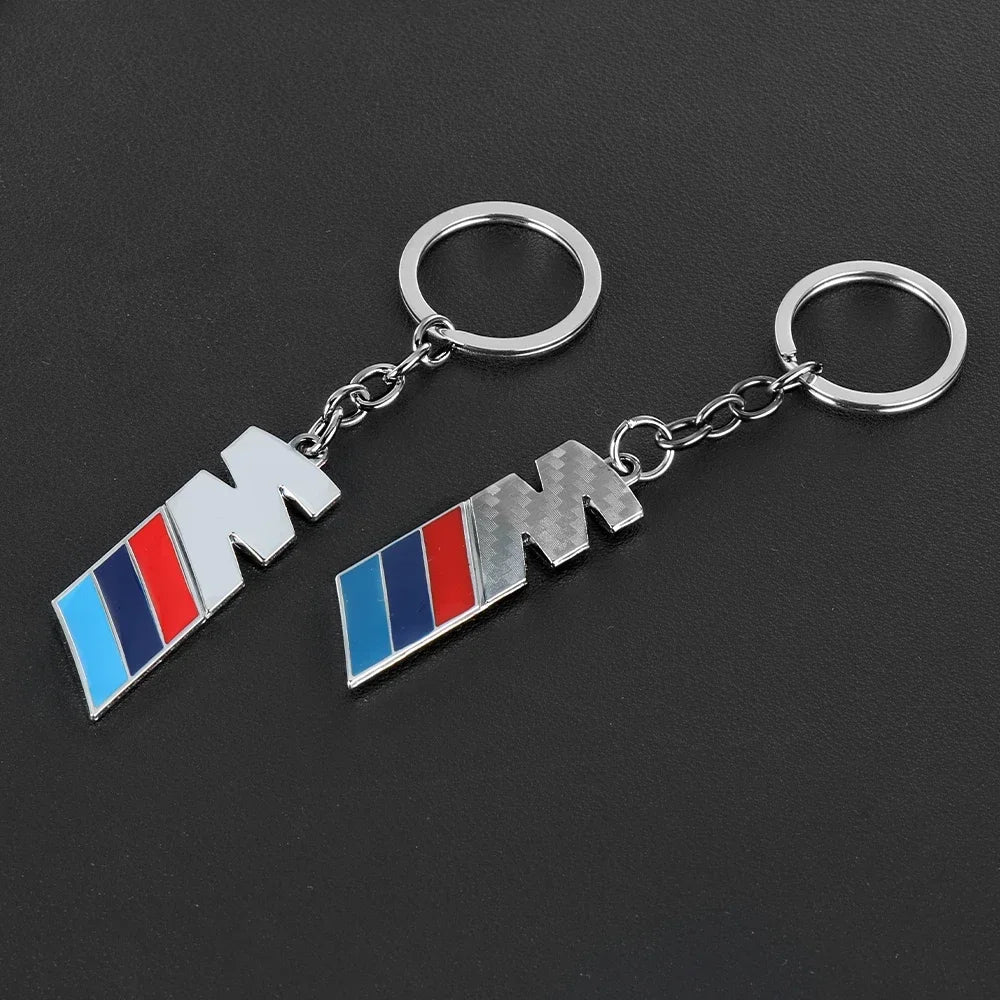"BMW logo keychain: A sleek accessory featuring the iconic BMW automobile brand emblem. This keychain is an excellent addition to any BMW enthusiast's collection or a thoughtful gift for a car lover."