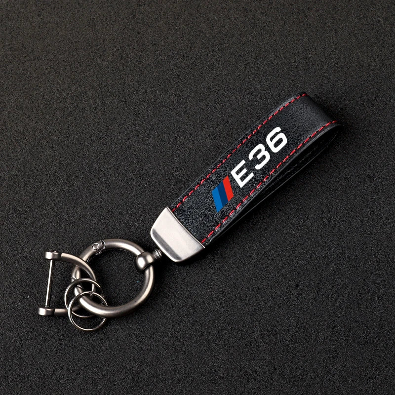 "BMW Logo Leather Keychain for BMW E36, E39, and E46 models. Includes keyring."