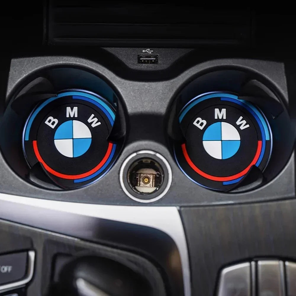 "BMW logo prominently displayed on the dashboard of this luxury vehicle."