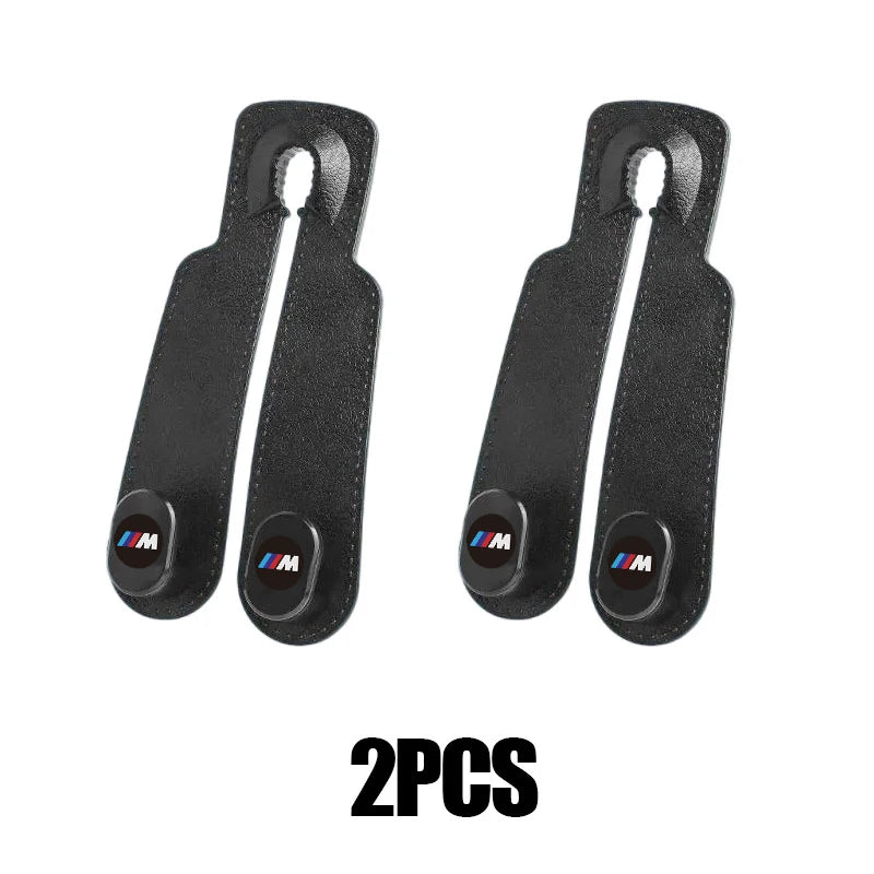 Two BMW E36, E39, E46 car seat headrest hooks. Genuine replacement parts.