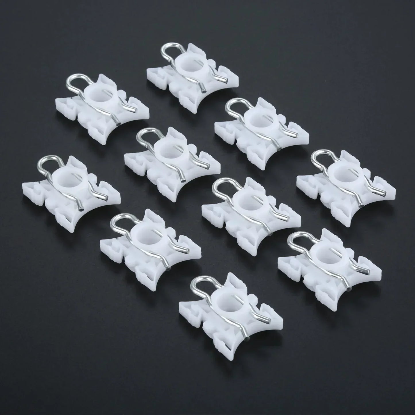 Ten white plastic pivot clips for BMW E36 window regulators.