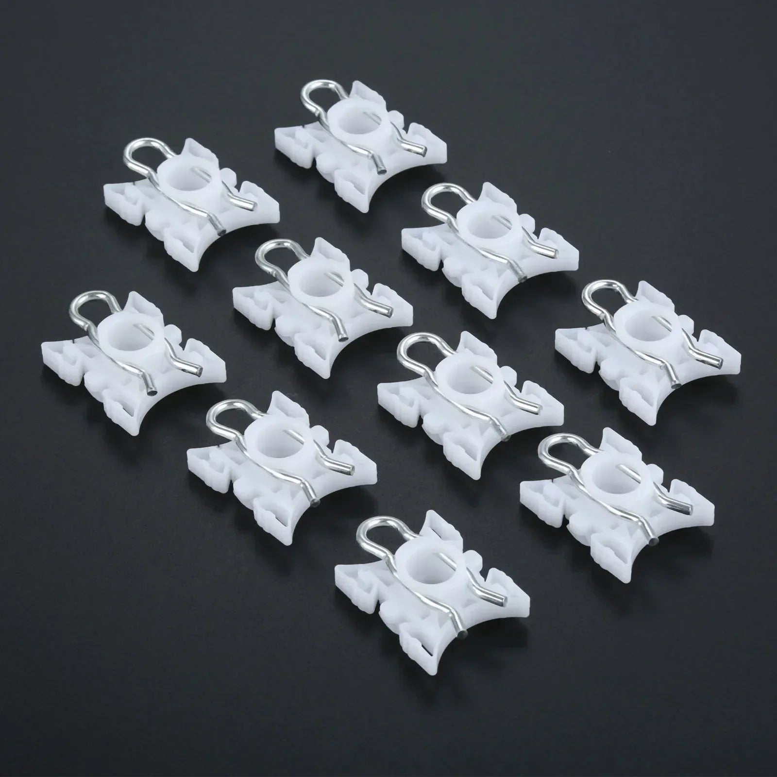 Ten white plastic pivot clips for BMW E36 window regulators.