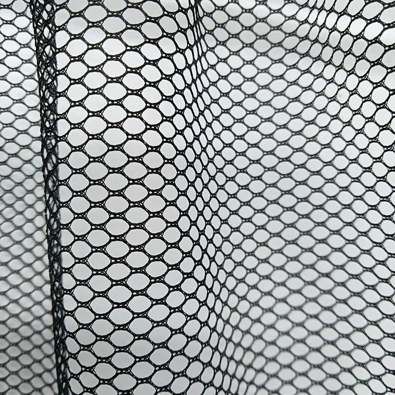 Black elastic mesh car trunk organizer with circular pockets, fitting select vehicle makes and models. Improves storage effic