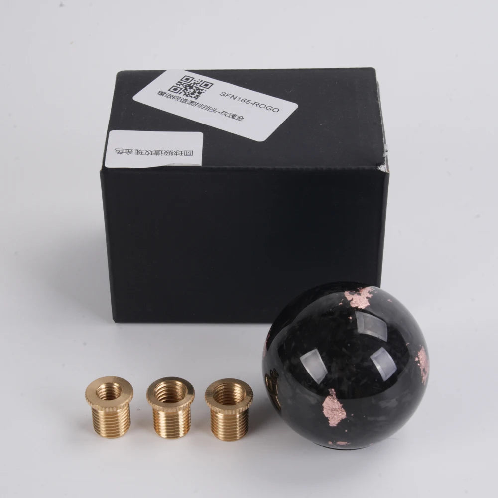 'Bartoo carbon fiber shift knob with black and gold accents. Includes matching screws. Fits manual or automatic.'