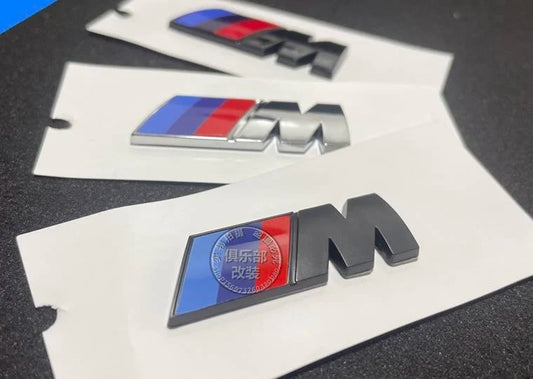 BMW M Emblem Set: Side and rear decals featuring the BMW "M" logo, not related to French football.