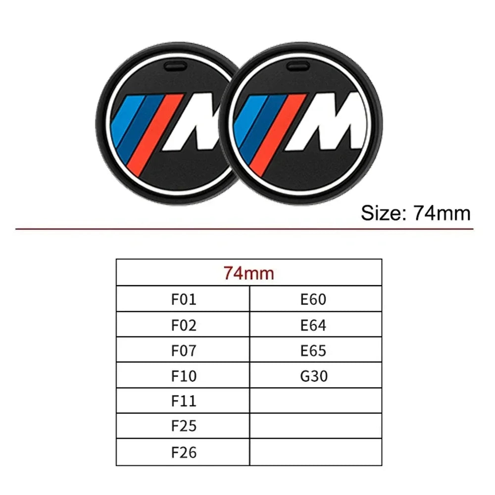Two BMW M logo coasters for car cup holders. Authentic BMW emblem design.