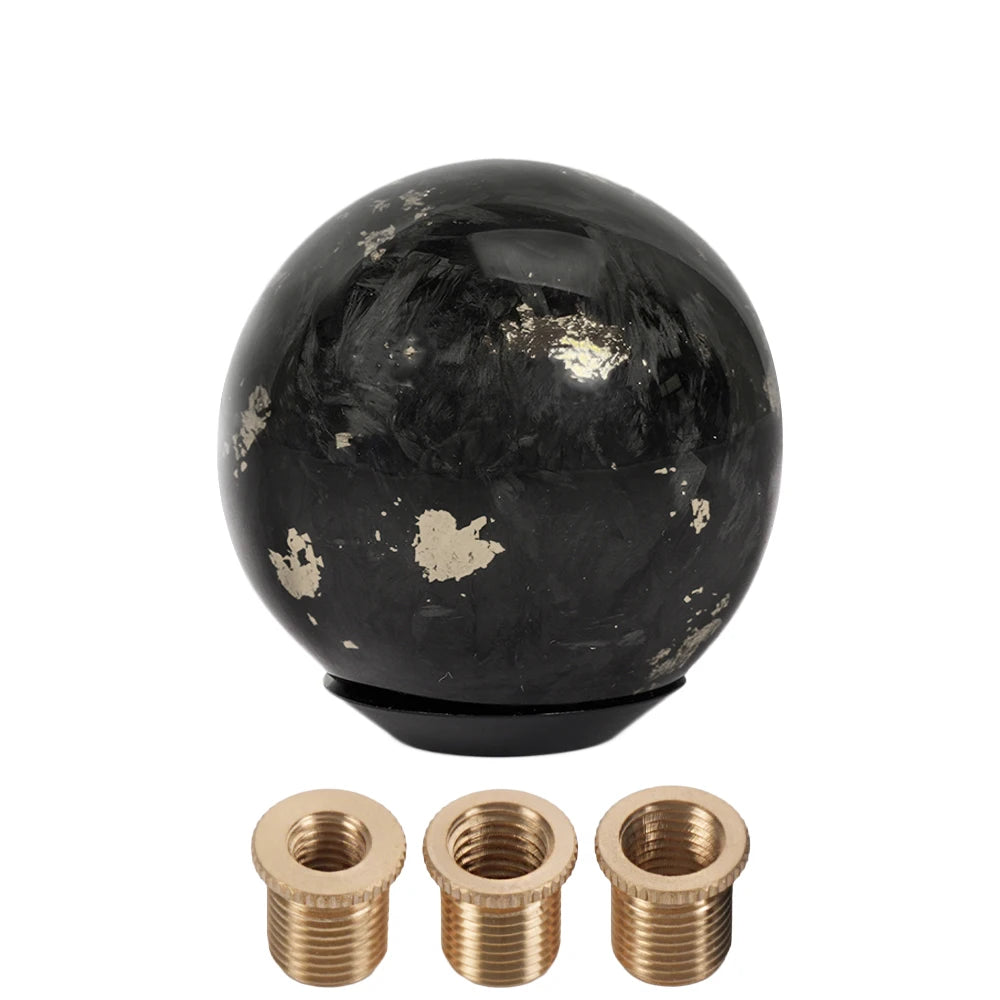 Black carbon fiber ball shift knob with brass fittings and one removable brass cap. Fits manual or automatic shifters in SFN1