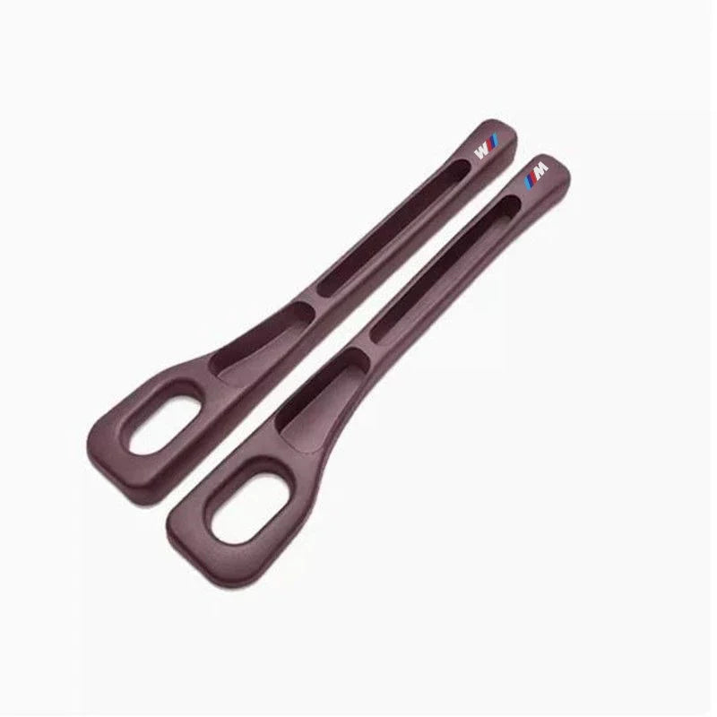 Two BMW seat gap fillers on a white background.

or

Universal fit BMW seat gap fillers in pair, shown on white background.