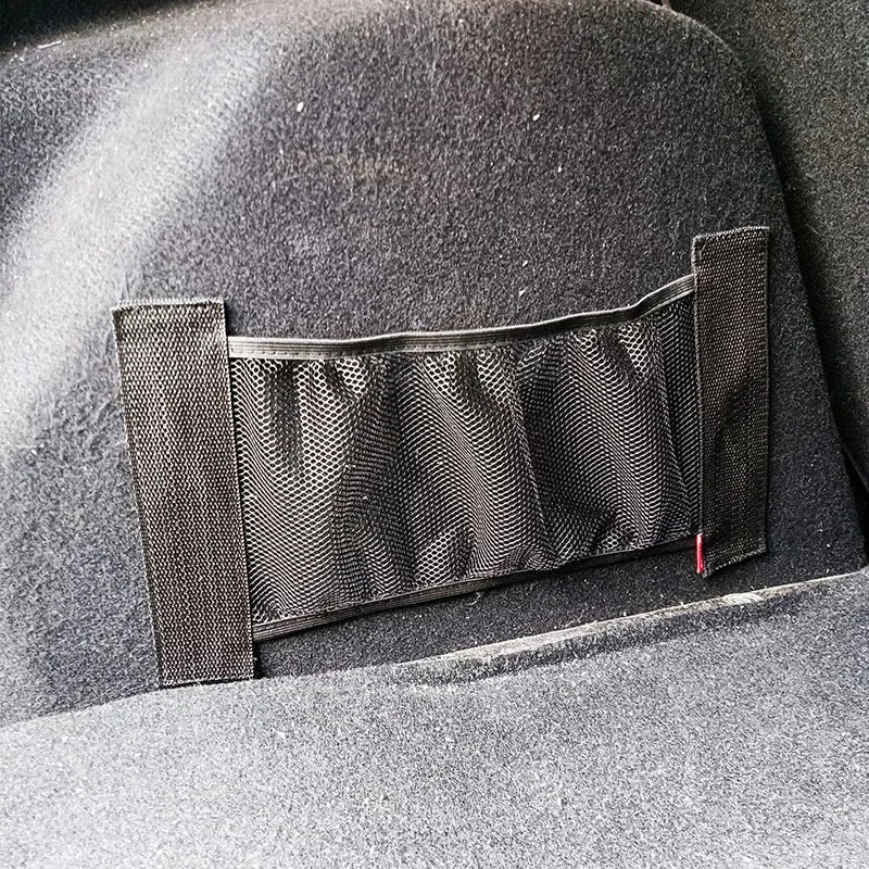 Car trunk organizer — fixed elastic mesh pocket for back seat. Attaches securely with straps. Perfect for tidy storage. Fits 