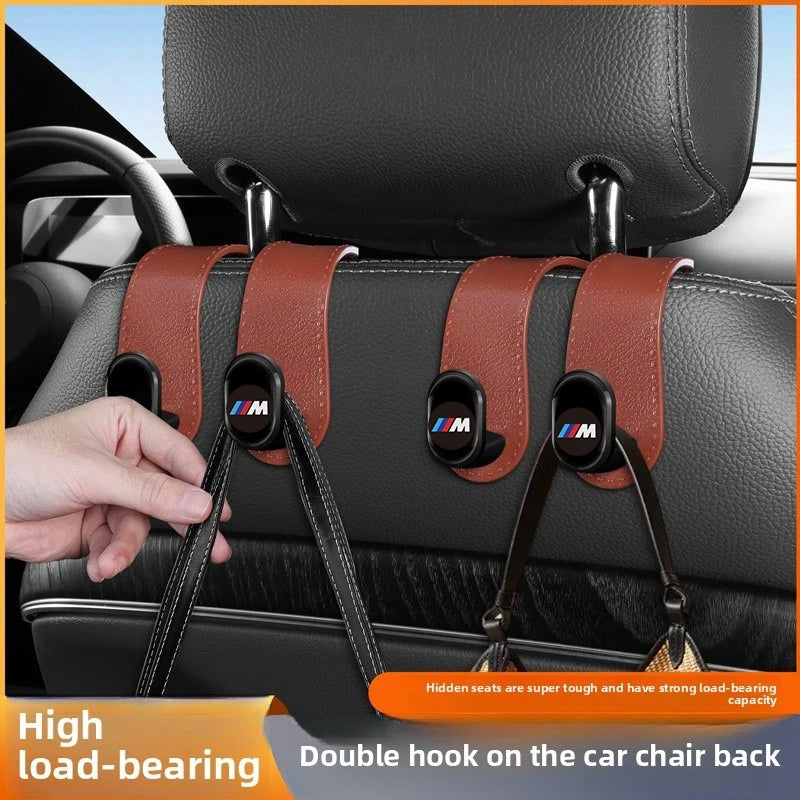 "BMW E36, E39, E46: Car Seat Headrest Hanger - Secures and organizes headrest-mounted seat belts."