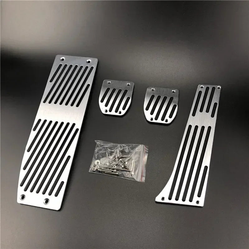 "Aluminum pedal covers in silver/black for BMW E30, E36, E46, E90, and M3 models. Replace stock pedals with sleek, durable co