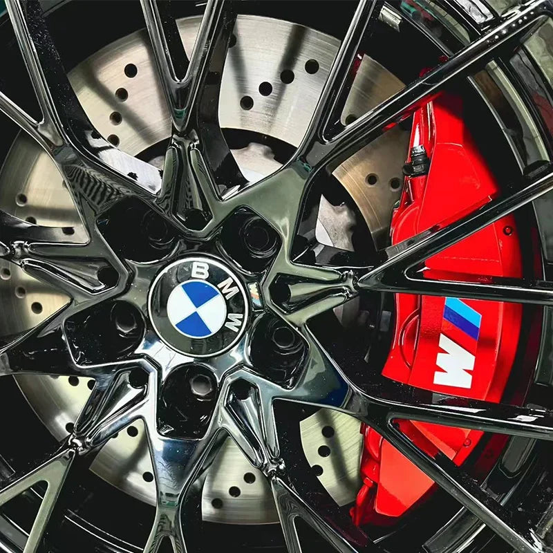 "Heat-resistant caliper sticker set (6pcs) for BMW wheels - Close-up view of red brake caliper."