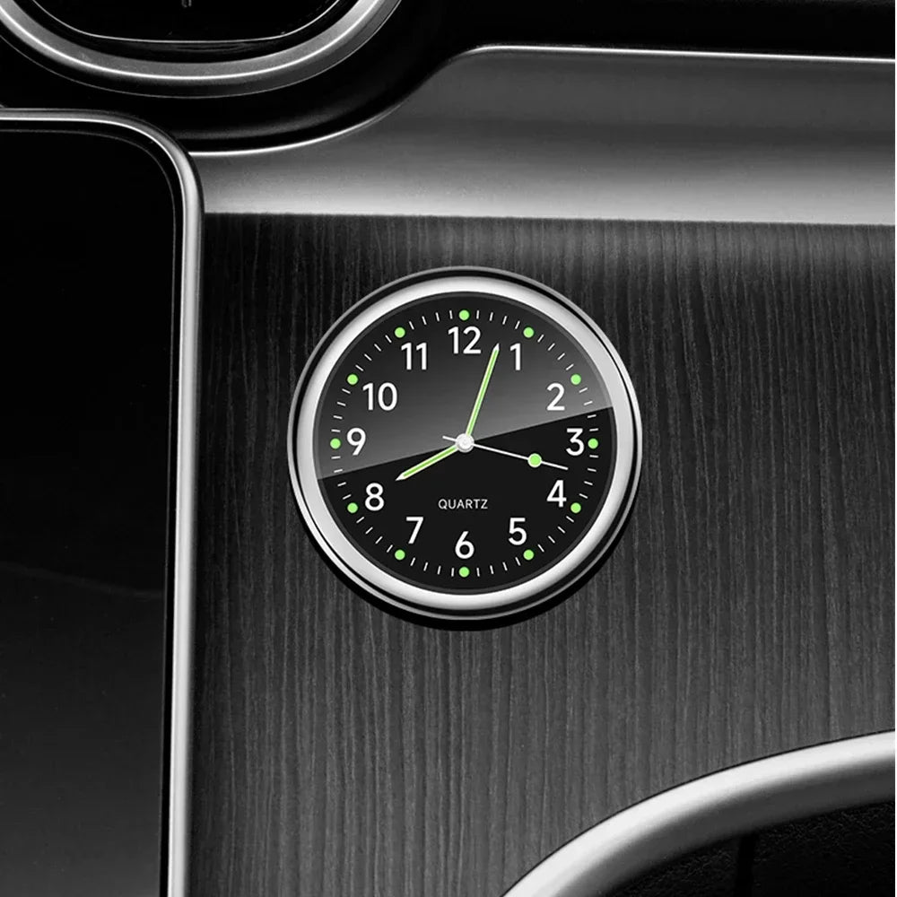 Mini luminous car clock - stick-on. Glows in dark. Shows time clearly with green numerals. Suitable for dashboard or gauge cl
