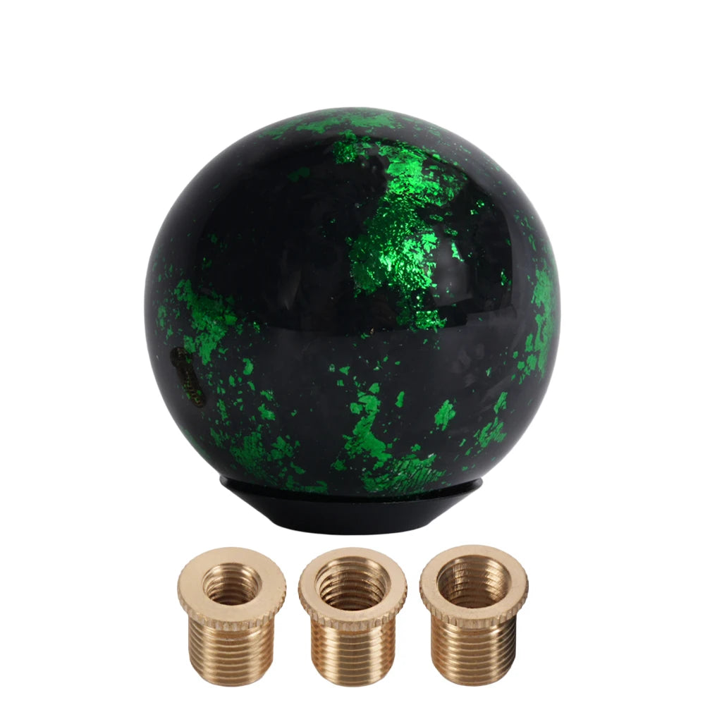 Carbon fiber ball shift knob in marble effect. Brass accents. Fits manual/auto (SFN165). Luxury upgrade. Product size: 70x70x