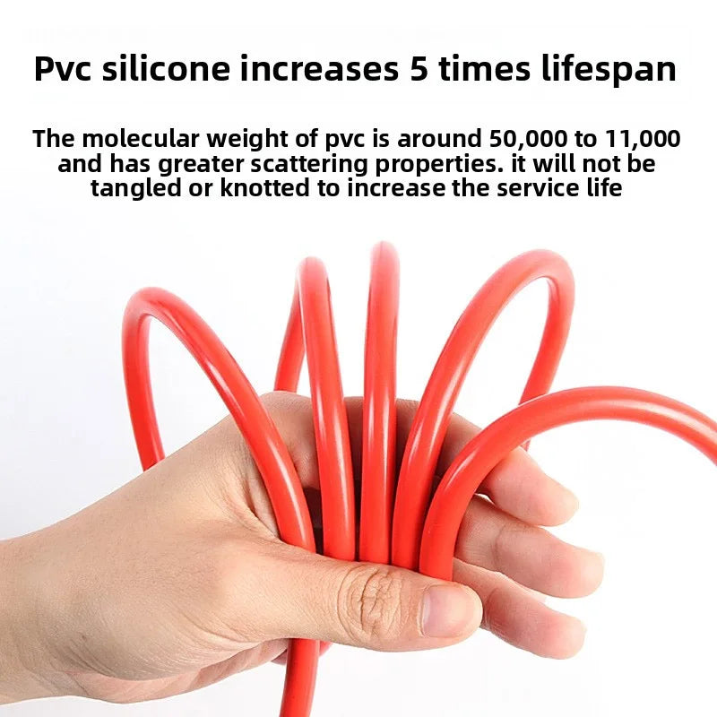 Red jumper cable in hand - emergency car starter tool.