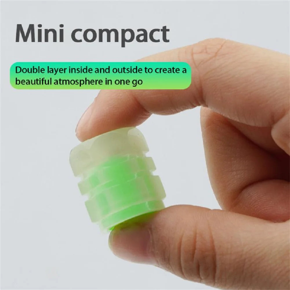 A hand is holding a 10-inch long, green, round-shaped plastic tube with a diameter of approximately 1.5 inches.