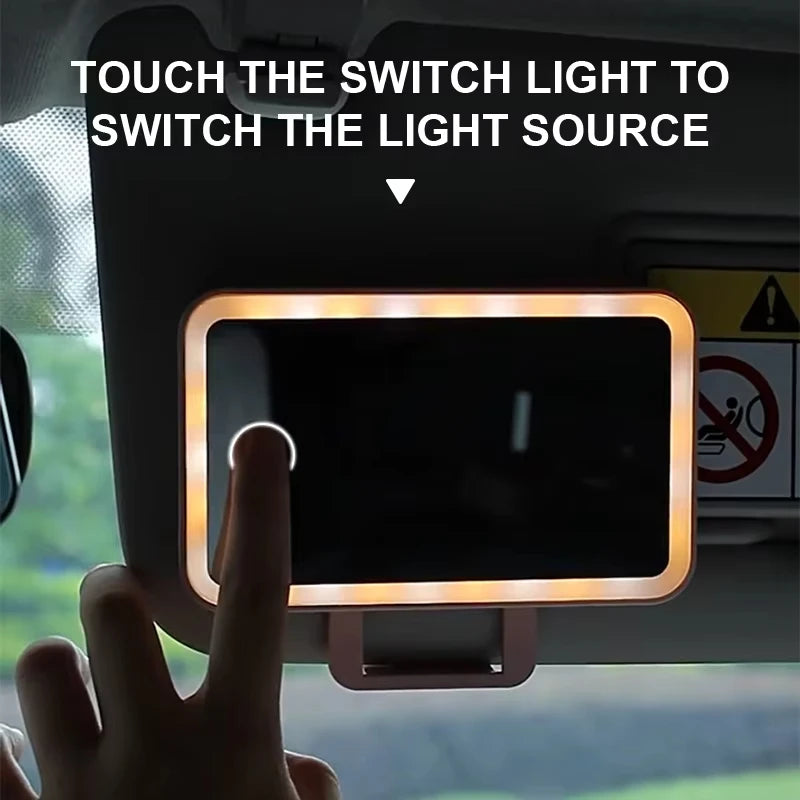 Person holding phone near car mirror with LED lighting. Showcases product context without distractions.