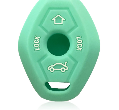 A green silicone toy featuring a distinct white arrow marking atop its surface.