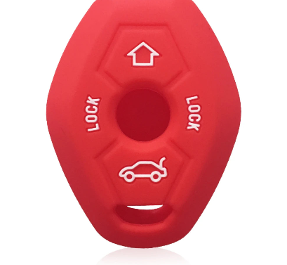 A red silicone toy featuring a distinct white arrow marker at the peak.