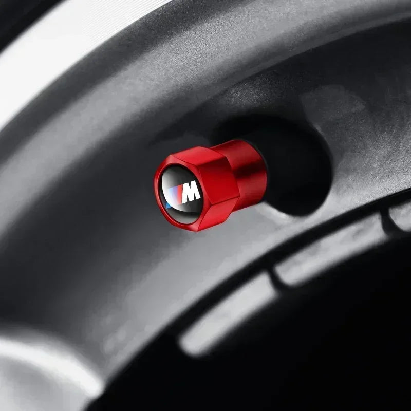 Red knob on a glossy black wheel with precise markings. This high-quality component boasts a smooth, tactile finish, ensuring a secure and comfortable grip for optimal control.