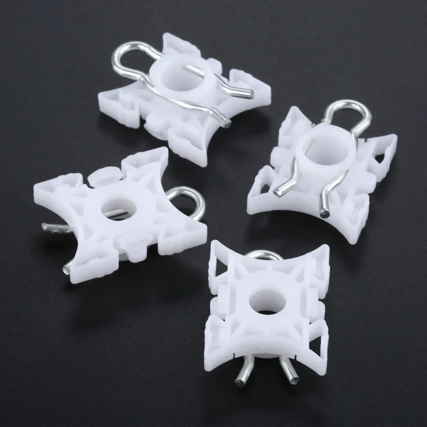 Ten white pivot clips for BMW E36 window regulators.