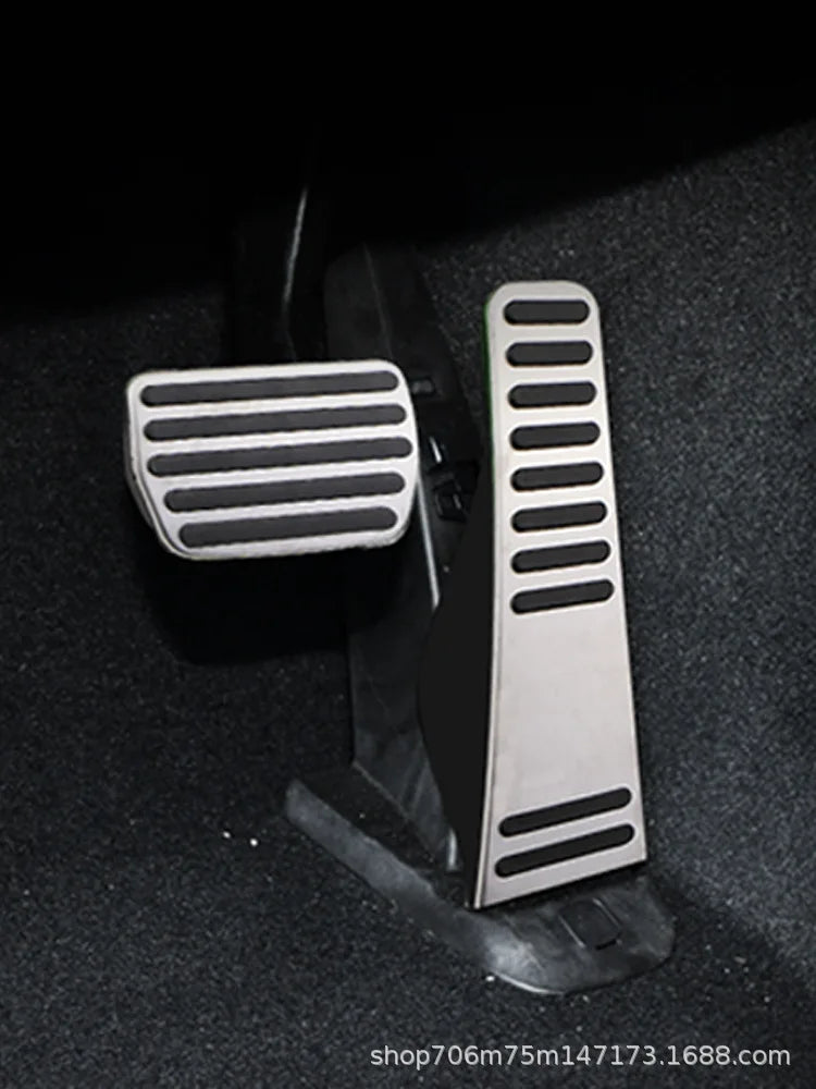 Black and silver anti-slip pedal covers for Volvo XC60, XC90, S90 (auto) - Showcasing one set on a dark background.