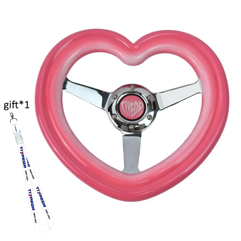 "320mm pink heart-shaped steering wheel cover with chrome accents and deep dish design (ABS material, includes 40mm spokes)."