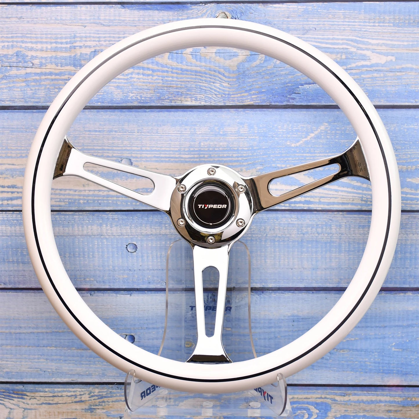 JDM-style 380mm quick-release wheel. Universal fit. Aluminum/leather finish. Wood grain backdrop. Car customization accessory