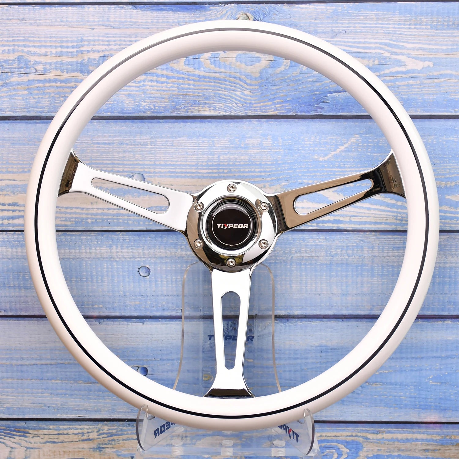 JDM-style 380mm quick-release wheel. Universal fit. Aluminum/leather finish. Wood grain backdrop. Car customization accessory