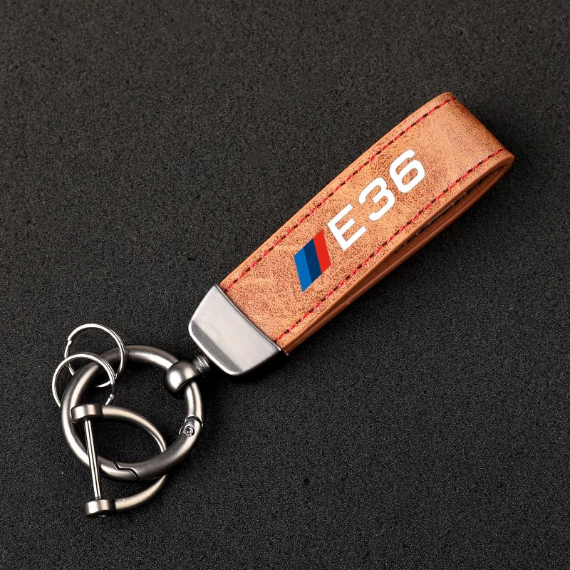 "Keychain accessory featuring a metal ring for securely attaching keys."