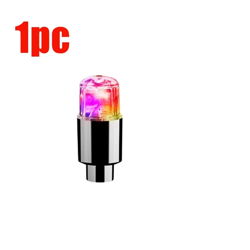 'White background with red/purple Universal Car Hub LED lights near valve stem. Product mounted; neon ambient effect.'