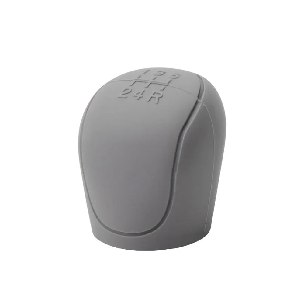 Gray universal handbrake cover with black handle.

Or for more context:
Gray silicone handbrake cover set with black handle f