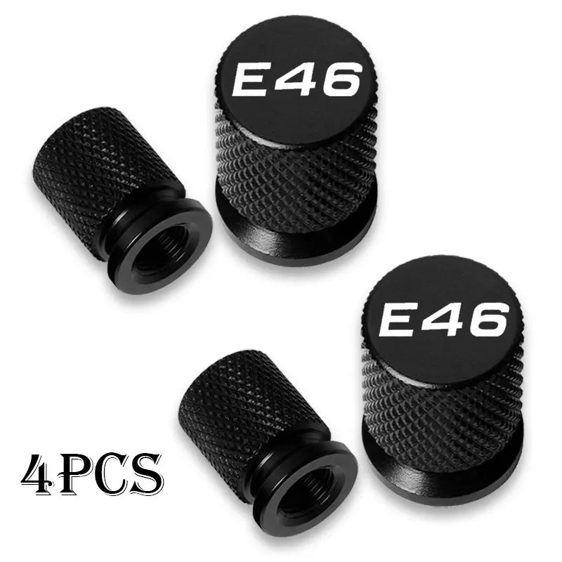 Four black aluminum valve stem caps for BMW E36, E46, and E34 vehicles.