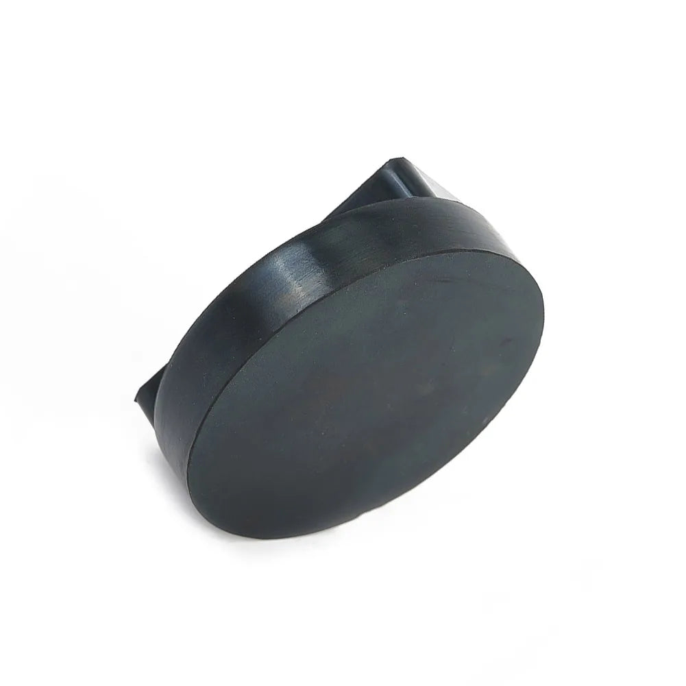 Black BMW jack stand rubber pad with distinct knob on a clean, white background.