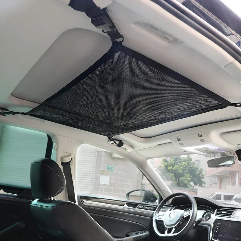 Black mesh roof bag for SUV interior cargo. Secure storage access above seats. Fits most models with roof rails. Dimensions: 