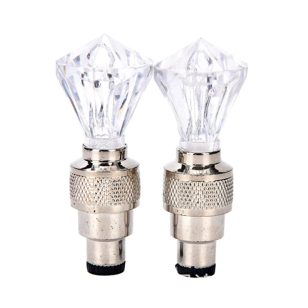 'Bicycle wheel valve caps with integrated LED lights (2 pieces). Replaces tire valve cap. Neon crystal diamond effect.'