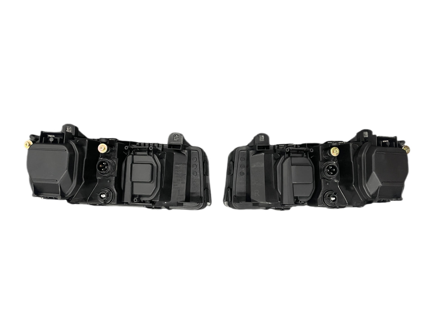 Two black housing units for BMW E36 Euro Projector Headlights.