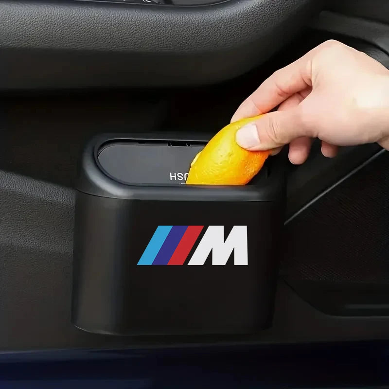 Person cleans door handle of BMW E36, E46, E90 X5 with Mini Hanging Car Trash Can.