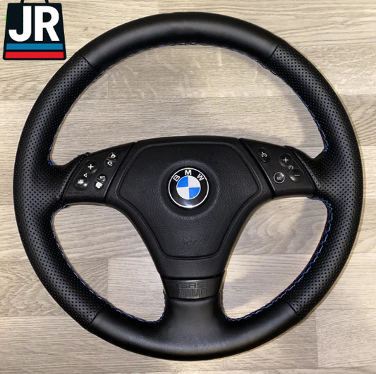 Soft leather BMW steering wheel cover with carbon fiber finish for E36, E46, and E39 models.